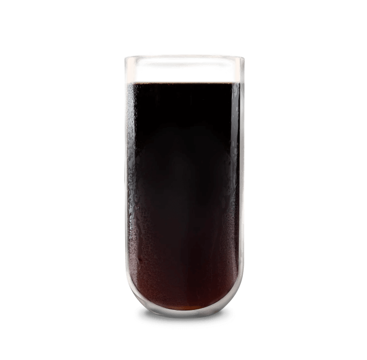 A tall glass containing cold brew coffee - black.