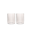 2 empty short glass cups with tapered interiors, so the bottom glass is thicker than the top.
