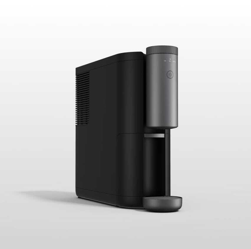 A thumbnail for a video showing a black Cumulus coffee machine sitting on a white table in a white room.