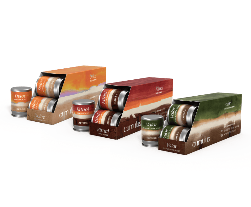 A set of 3 boxes of capsules floating next to each other. The flavors visible are "Delve medium roast", "Ritual dark roast", and "Valor medium-dark roast"