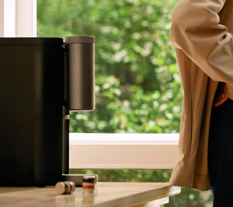 Cumulus machine on a counter with a pair of coffee capsules
